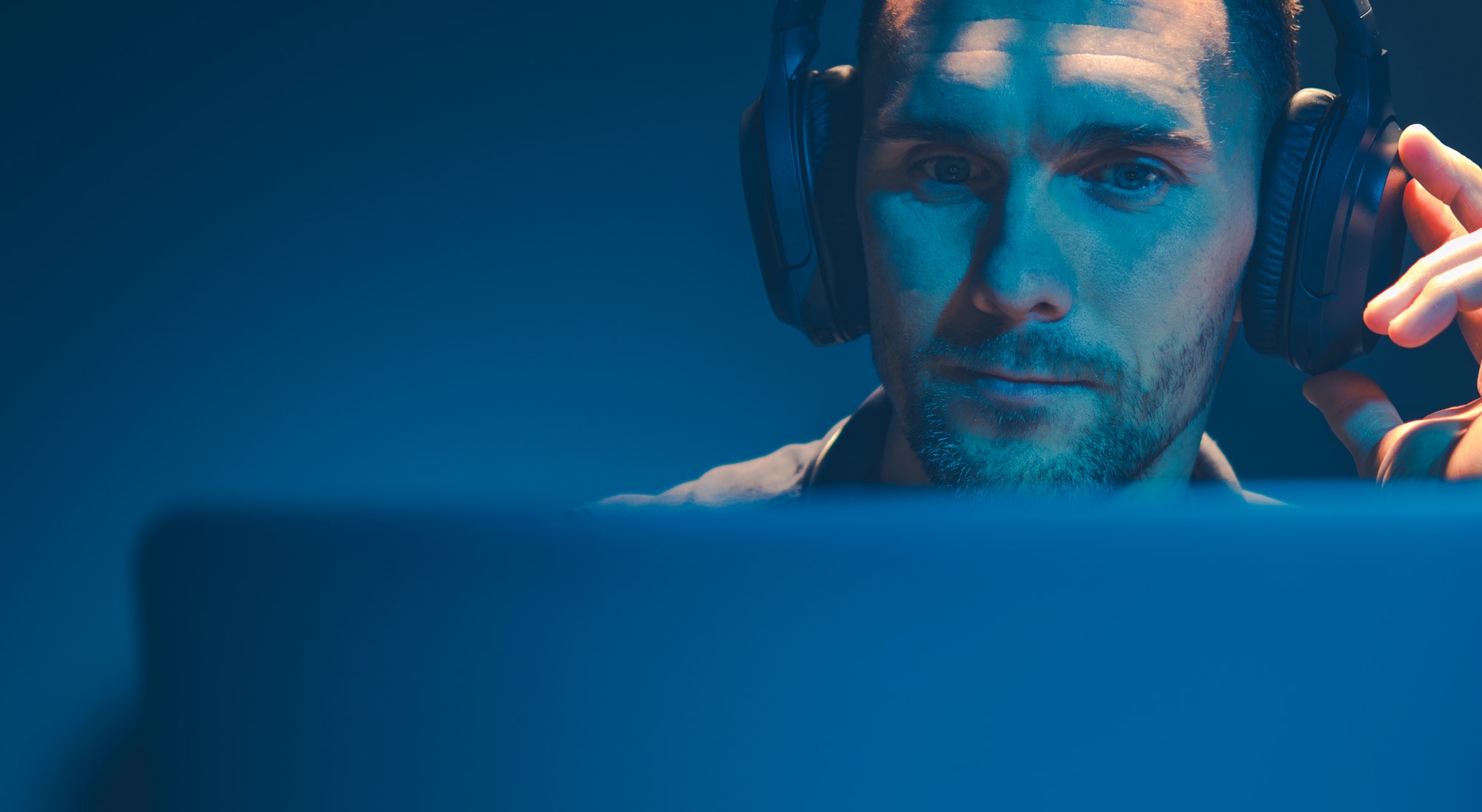 men listening podcast on his wireless headphones