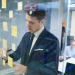 businessman writing his plans at office