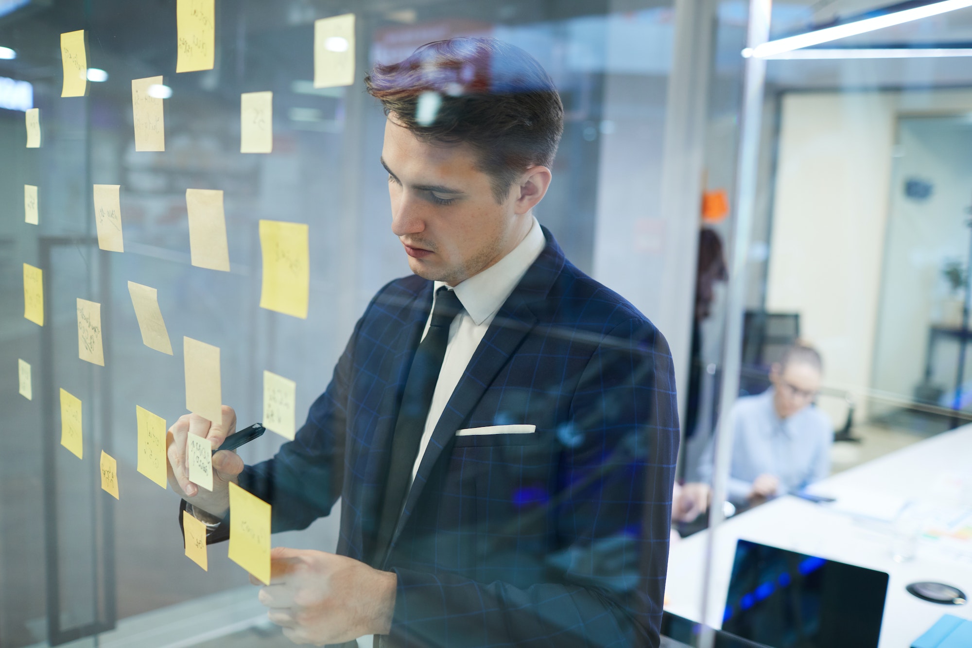 businessman writing his plans at office